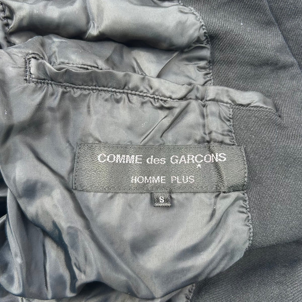Close up view of Comme des Garcons Homme Plus Black Patchwork Blazer Jacket F/W05 Tag