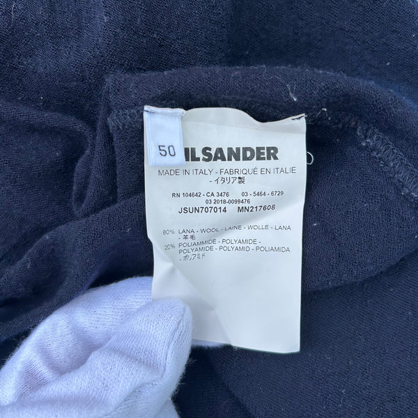 View of the tag of a Jil Sander Blue Wool Mockneck Sweater